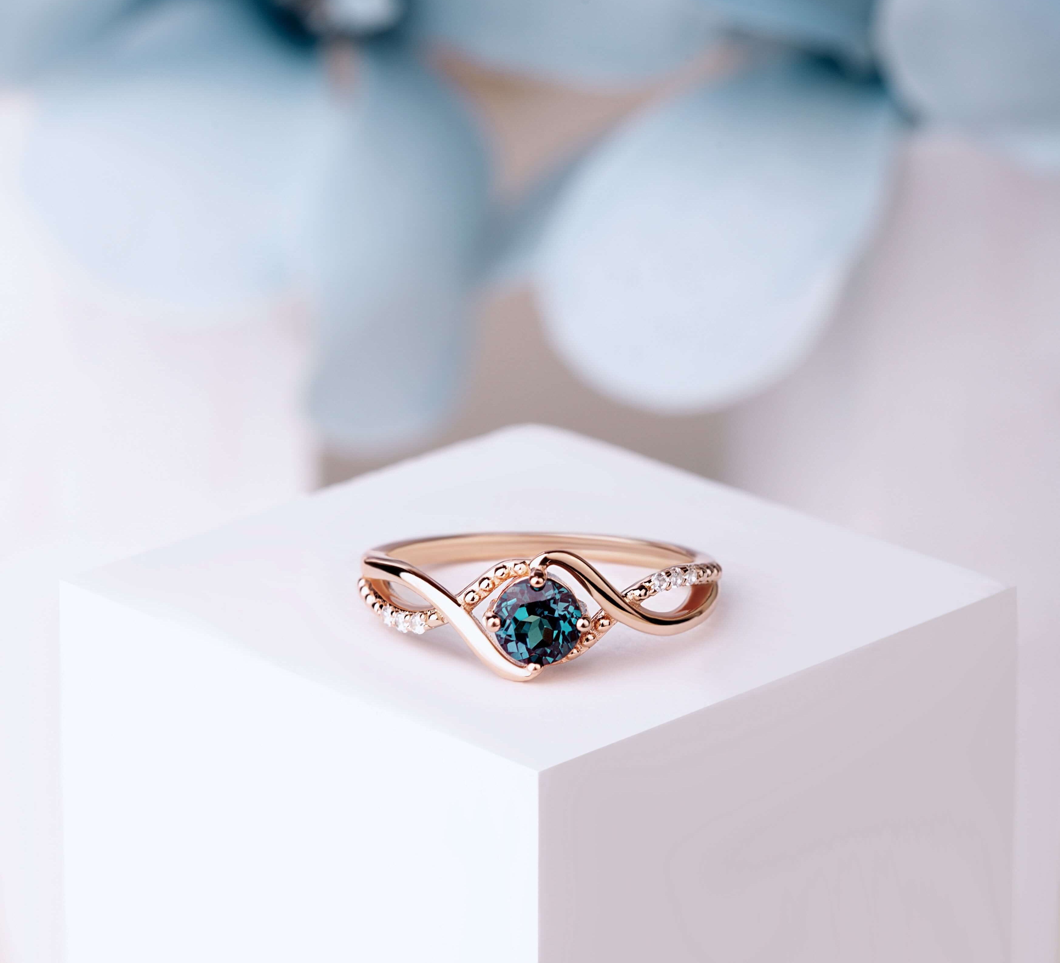Alexandrite statement ring with intricate detailing and sparkling accents