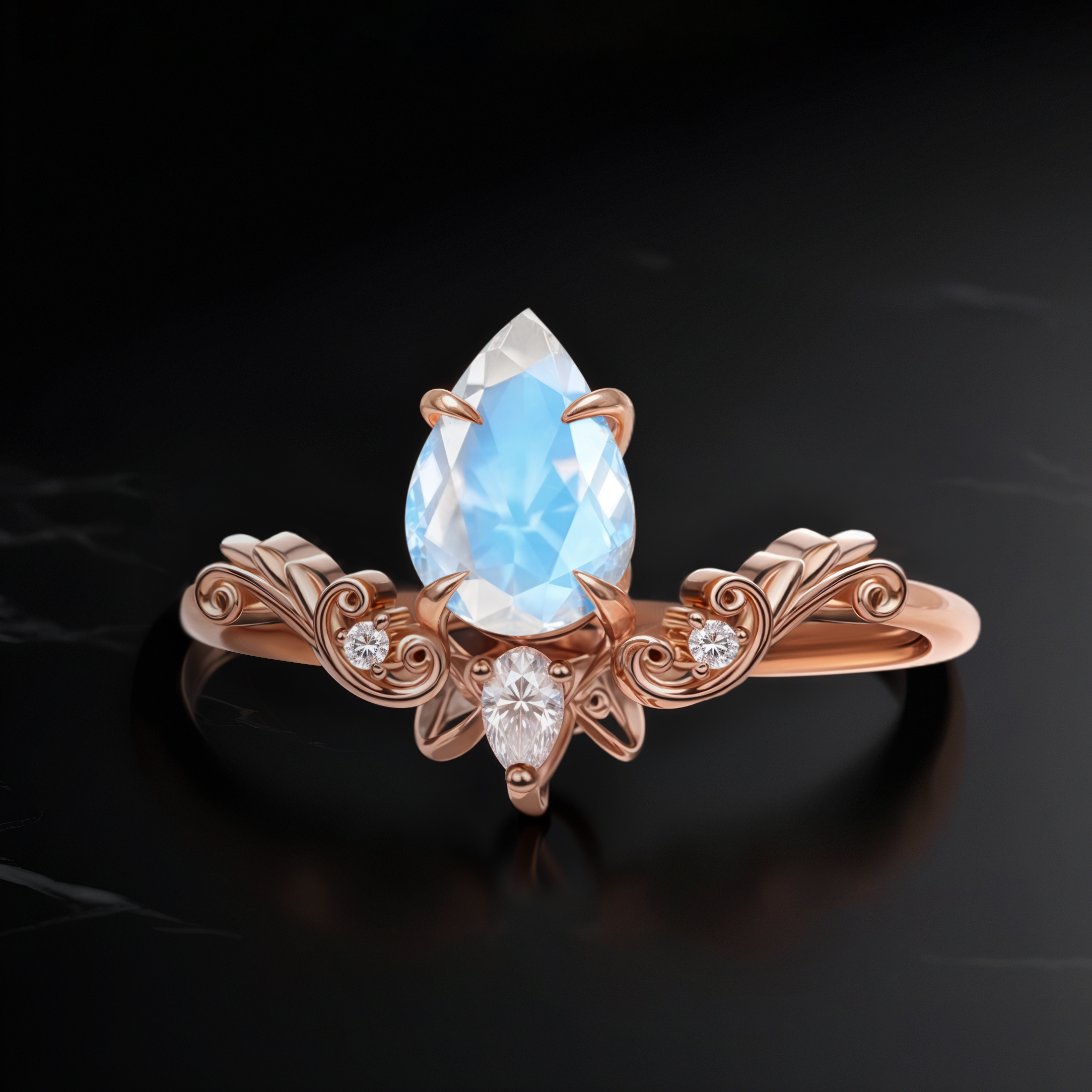 Top view of Vintage Drop Moonstone ring in rose gold, showcasing an 8 mm pear-cut Moonstone in a vintage-inspired band with scroll details