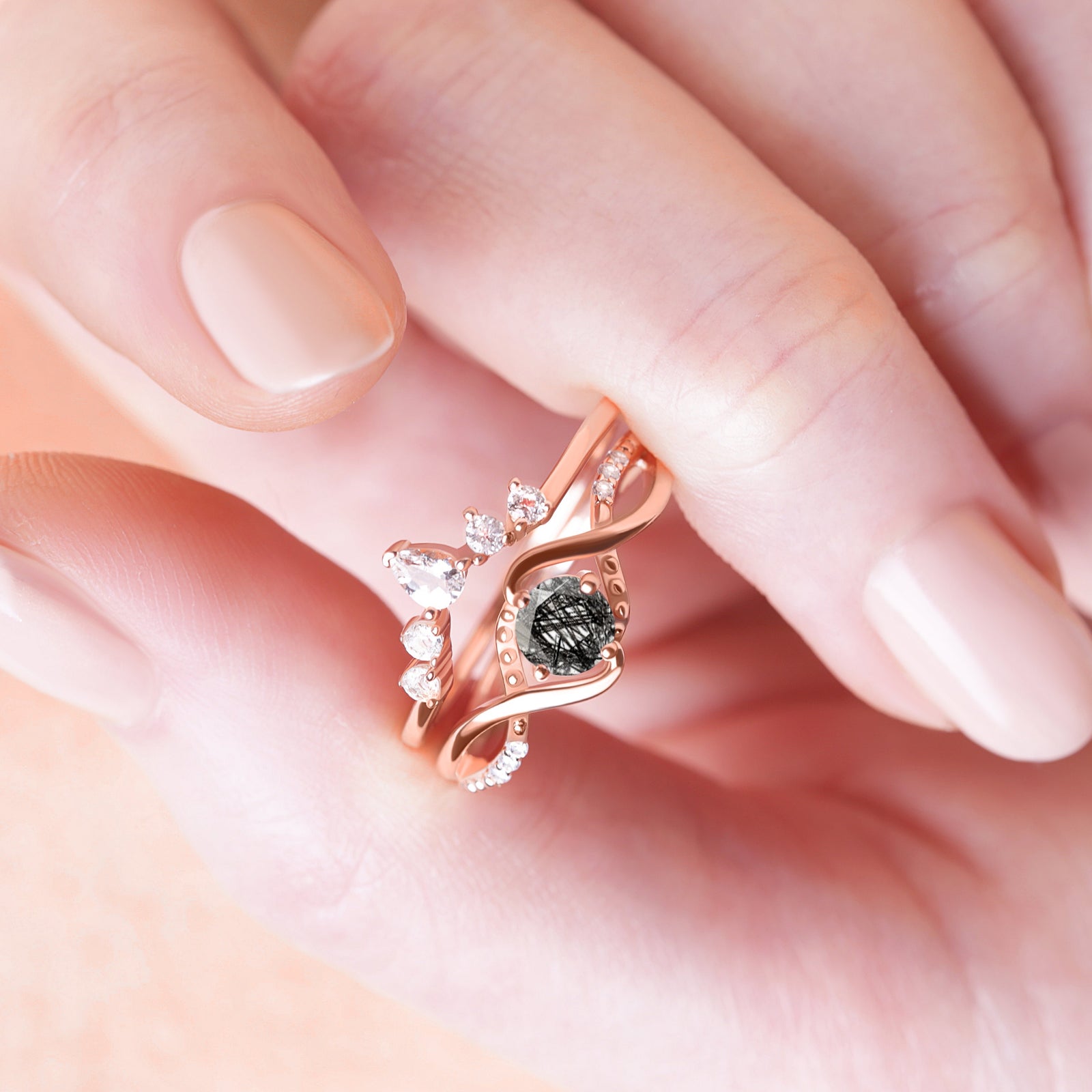 Another close-up detail of the Black Rutilated Quartz Engagement Ring Set on a model’s finger, emphasizing the ring’s elegance and intricate design