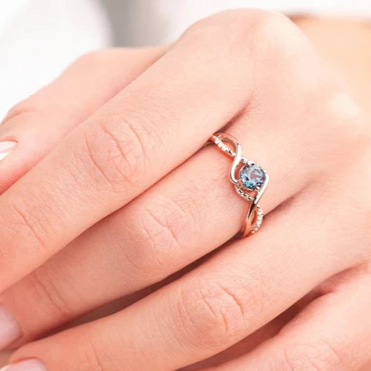 Model wearing the June Birthstone Elegance ring, featuring a Lab-Created Alexandrite and 24K gold-plated band
