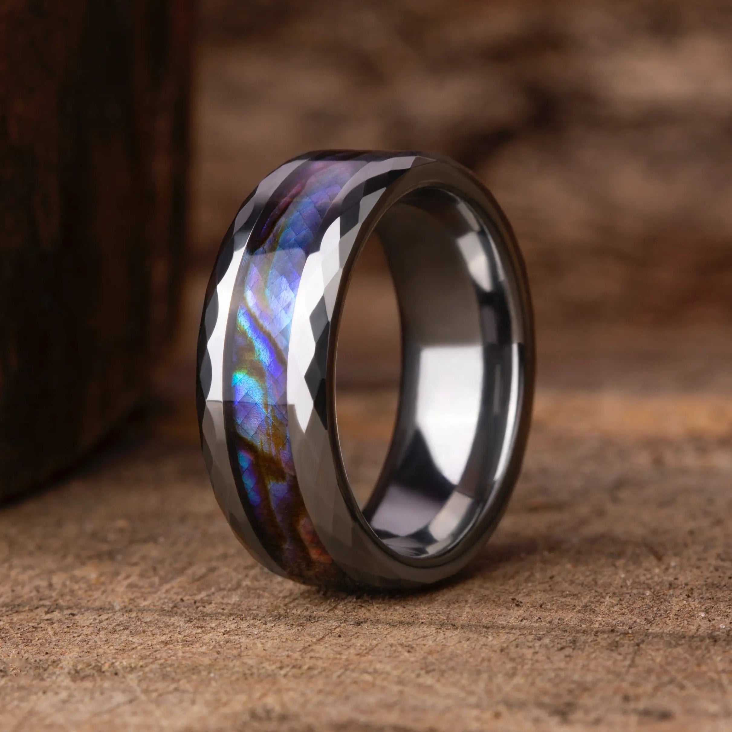 Tungsten ring with abalone shell inlay.