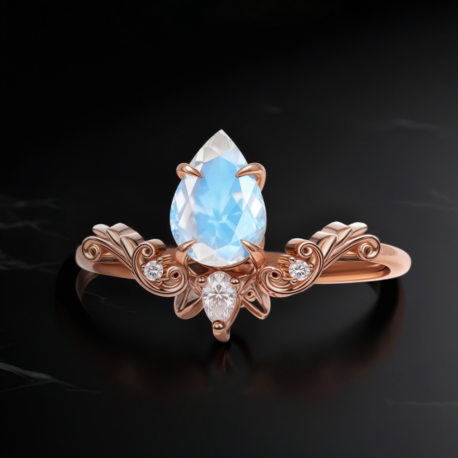 Top view of Vintage Drop Moonstone ring in rose gold, showcasing an 8 mm pear-cut Moonstone in a vintage-inspired band with scroll details