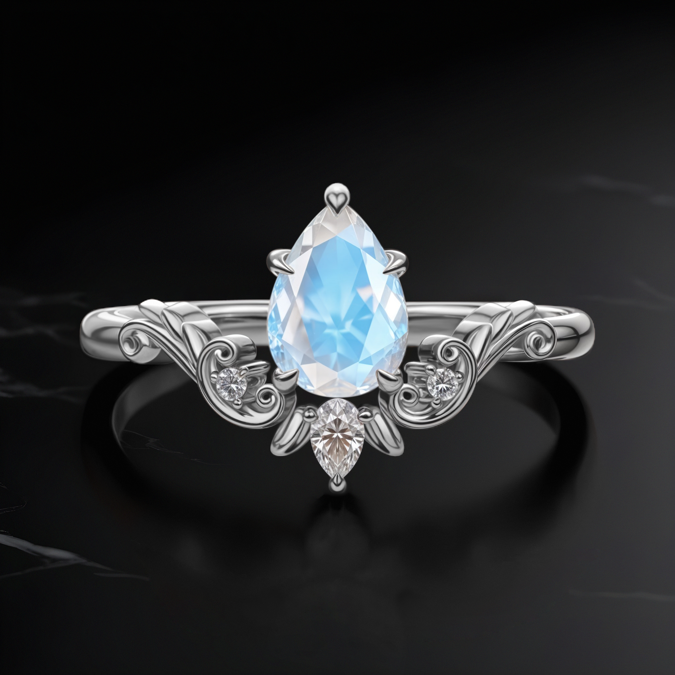 Front view of Vintage Drop Moonstone ring in silver, highlighting an 8 mm pear-cut Moonstone with delicate scrollwork on the band