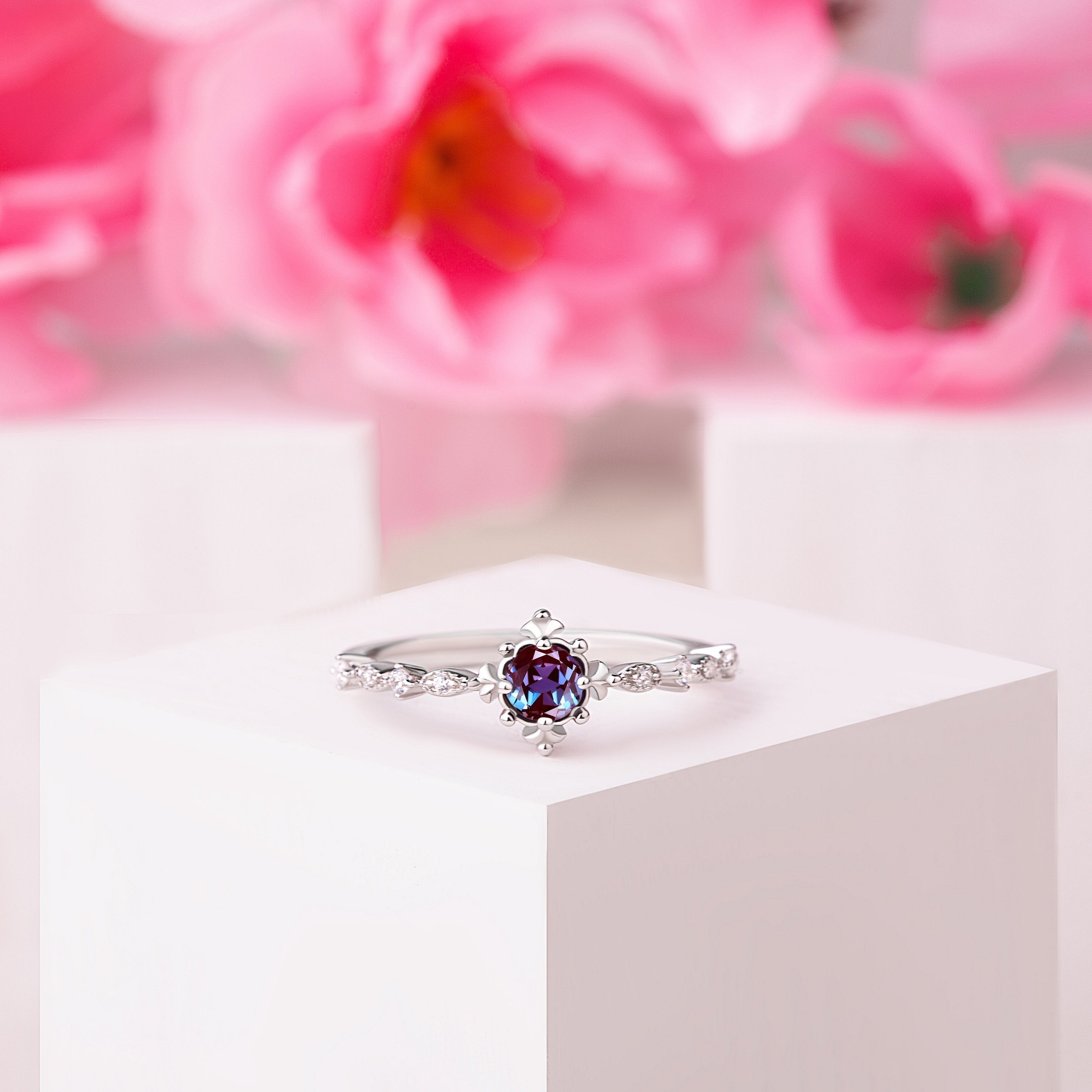 Front view of the Alexandrite Engagement Sparkling Ring in silver gold, showcasing the Alexandrite gemstone and sparkling White Zircon accents