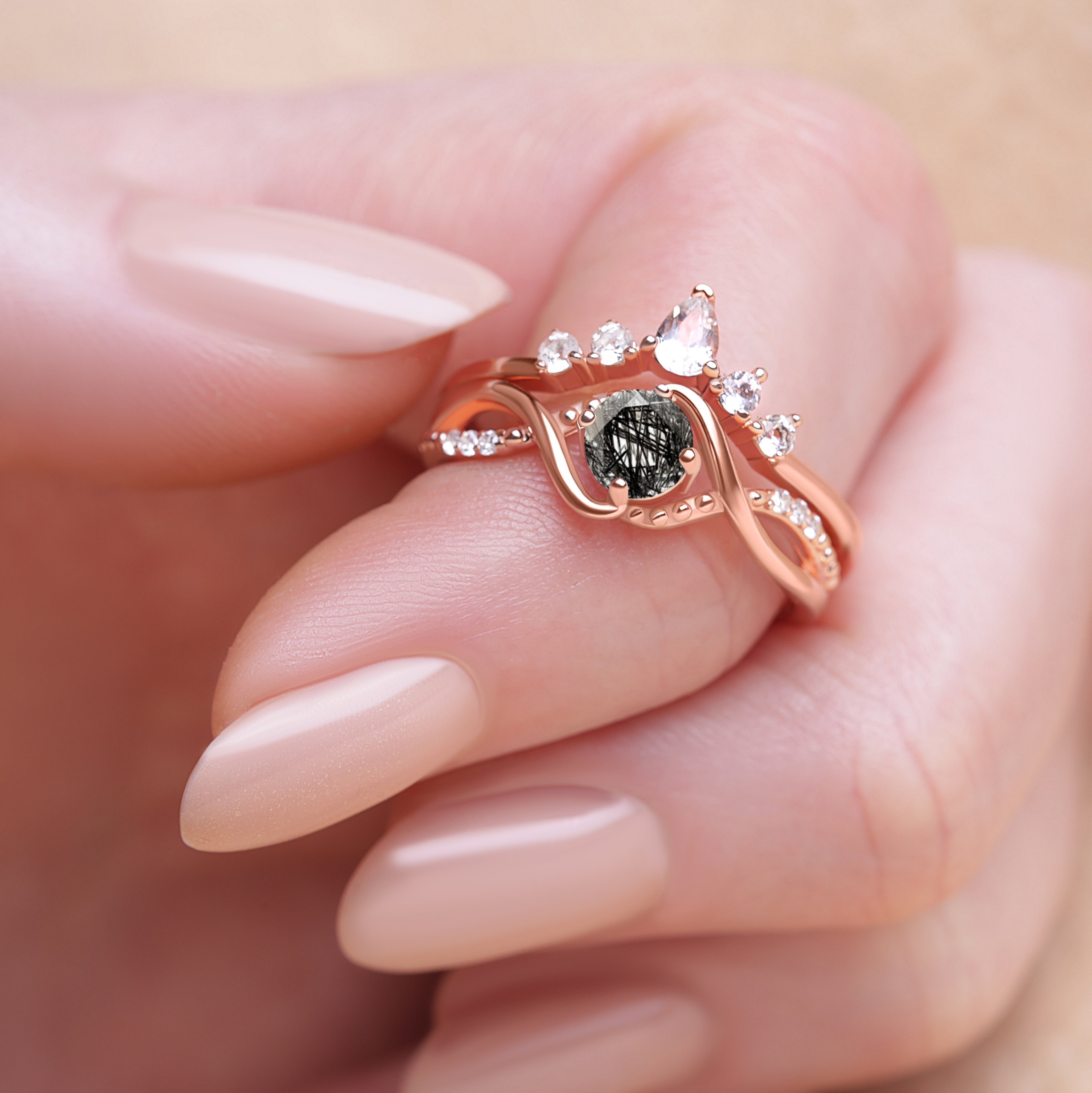 Close-up detail of the Black Rutilated Quartz Engagement Ring Set on a model’s finger, emphasizing the ring’s elegance and intricate design.