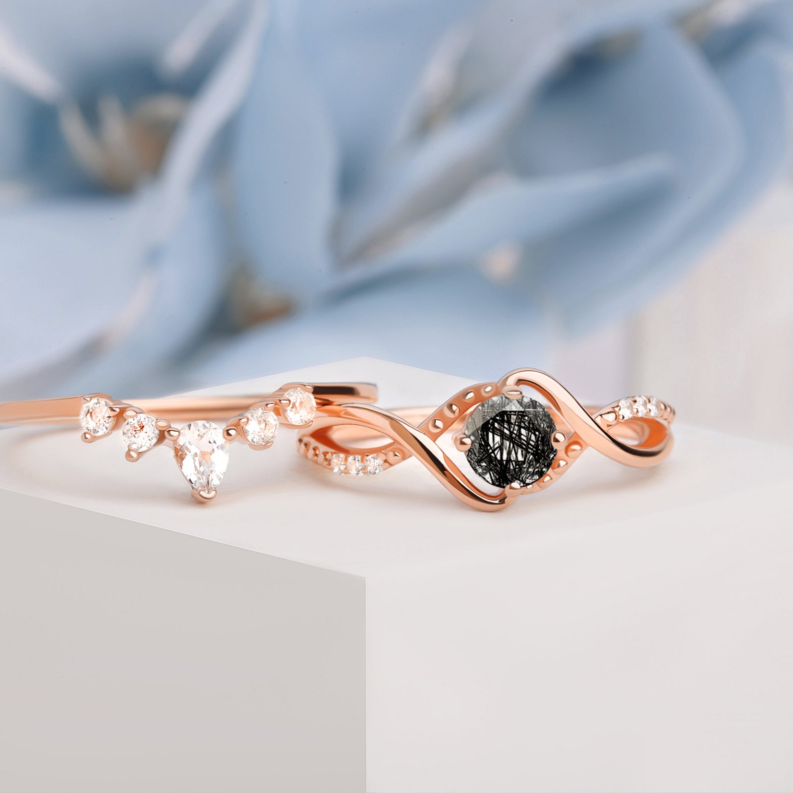Side view of the Black Rutilated Quartz Engagement Ring Set in rose gold, showcasing the detailed craftsmanship and luxurious finish.