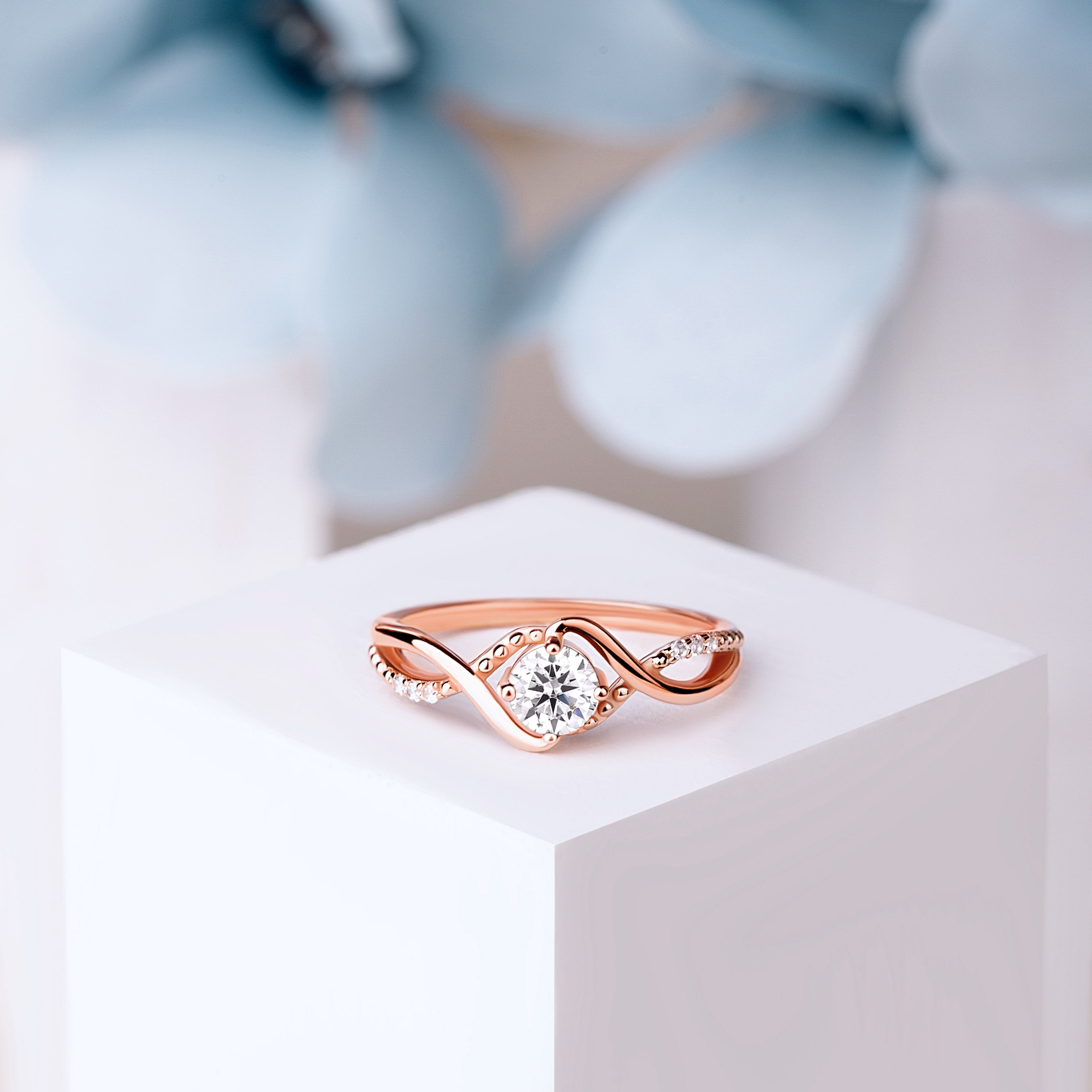 Front view of the Bridal Elegance in Rose Gold ring, featuring a brilliant moissanite gemstone and 24K rose gold-plated sterling silver band.