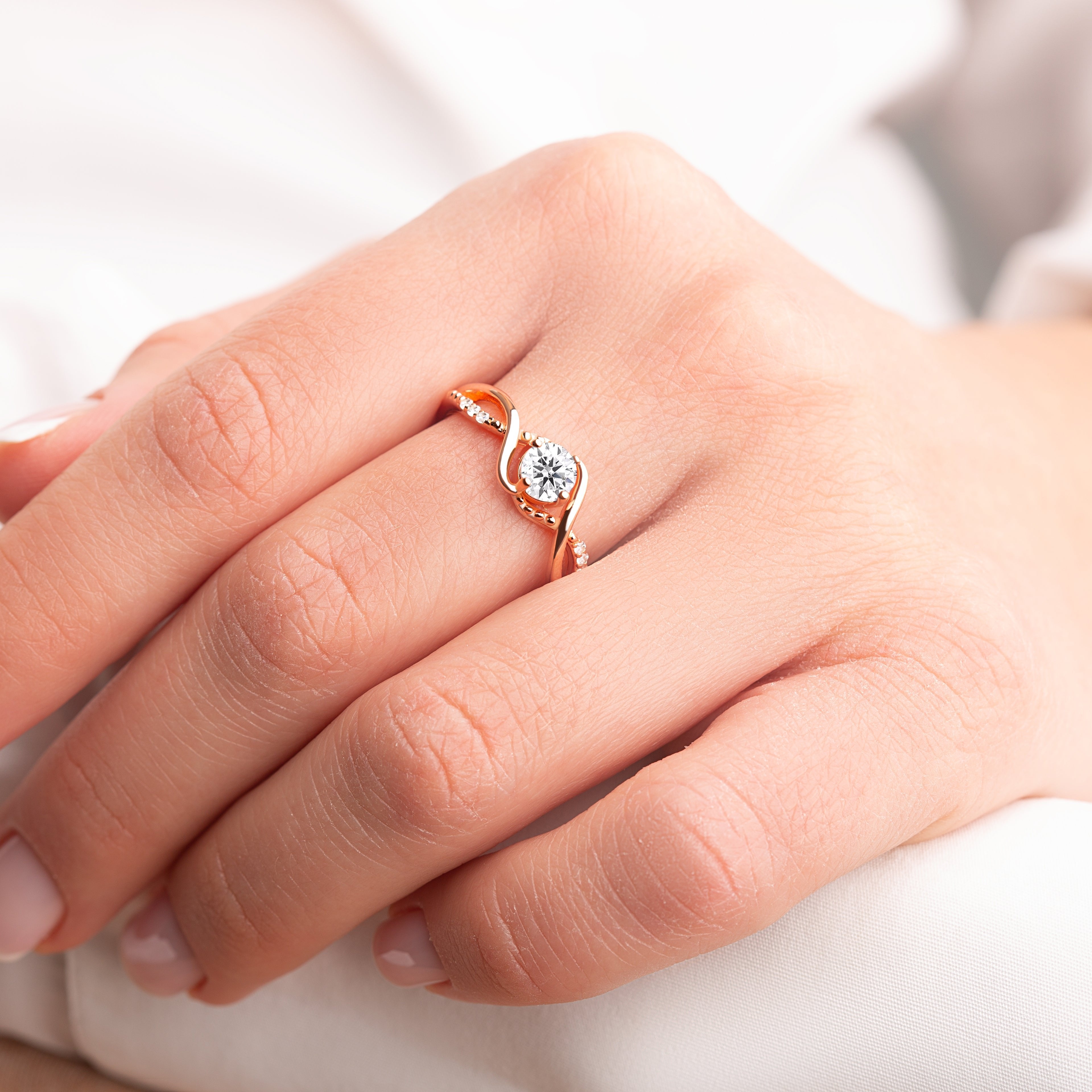 Side view of the Bridal Elegance in Silver and Gold ring, highlighting the brilliant moissanite gemstone and the luxurious 24K gold-plated silver band."