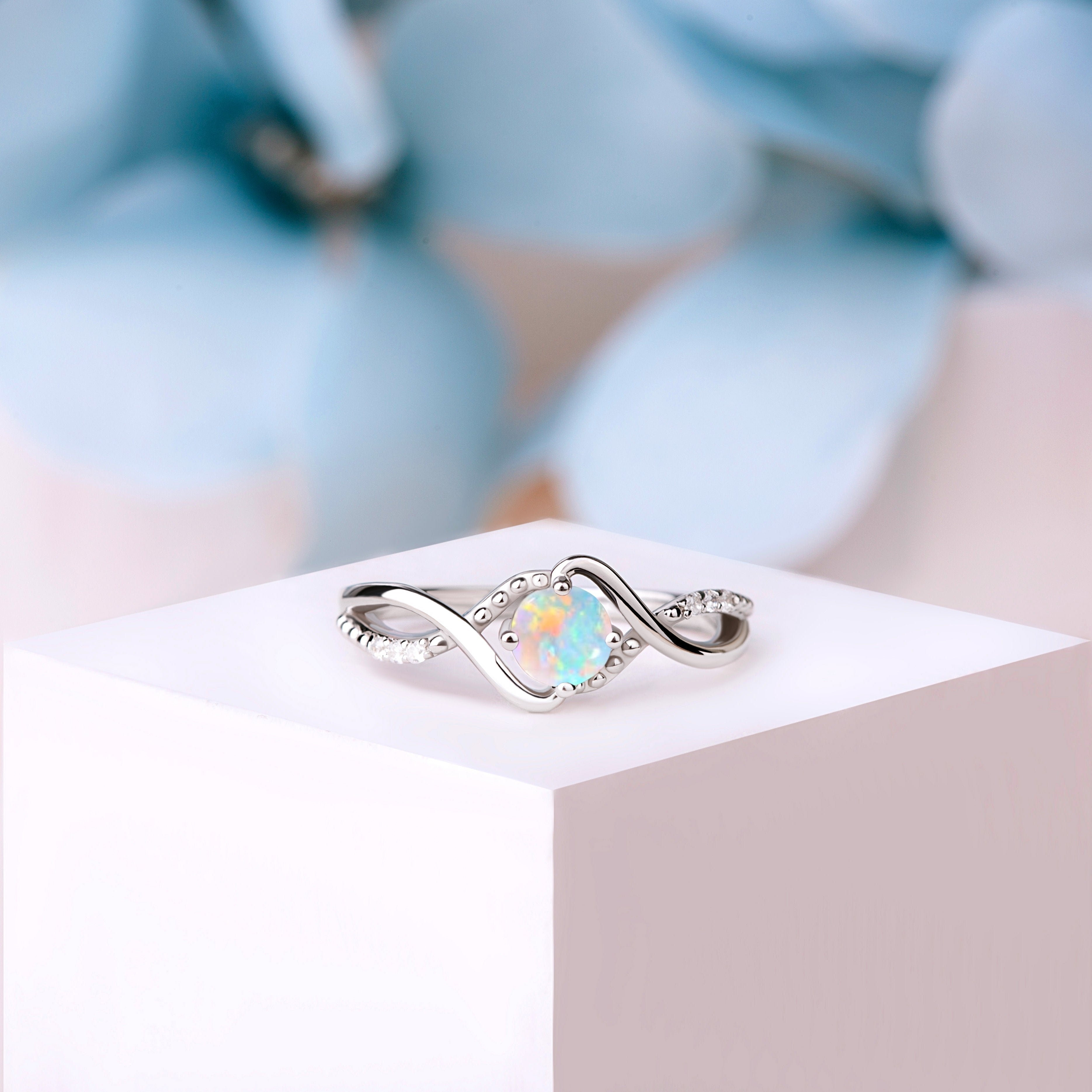 Close-up of the Bridal Opal Art Deco Wedding Ring in silver, featuring a captivating 5mm oval-cut White Opal and vintage-inspired milgrain detailing.