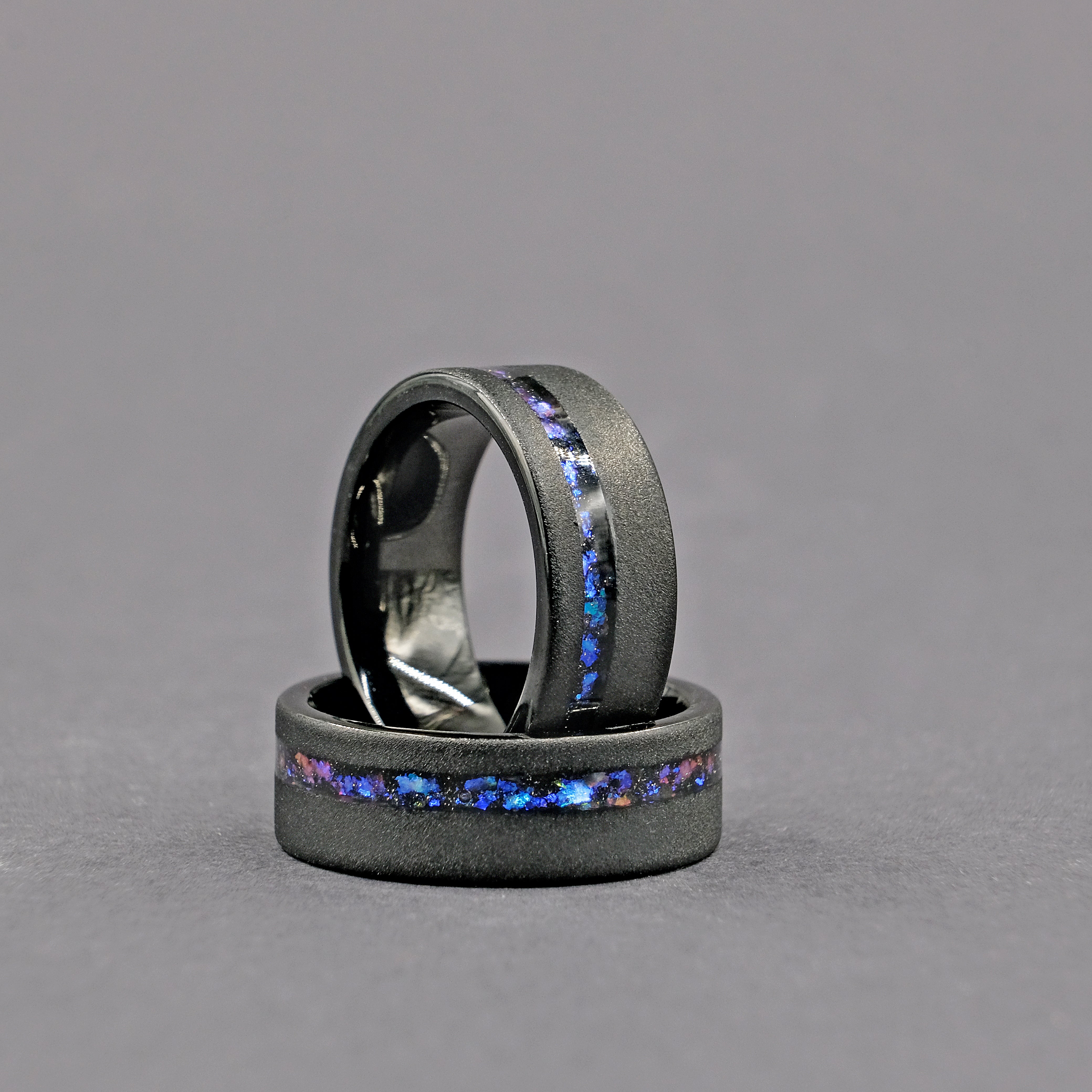 Vertical shot of the Domed Galaxy Opal Wedding Ring set, showcasing the elegant design and cosmic opal inlays