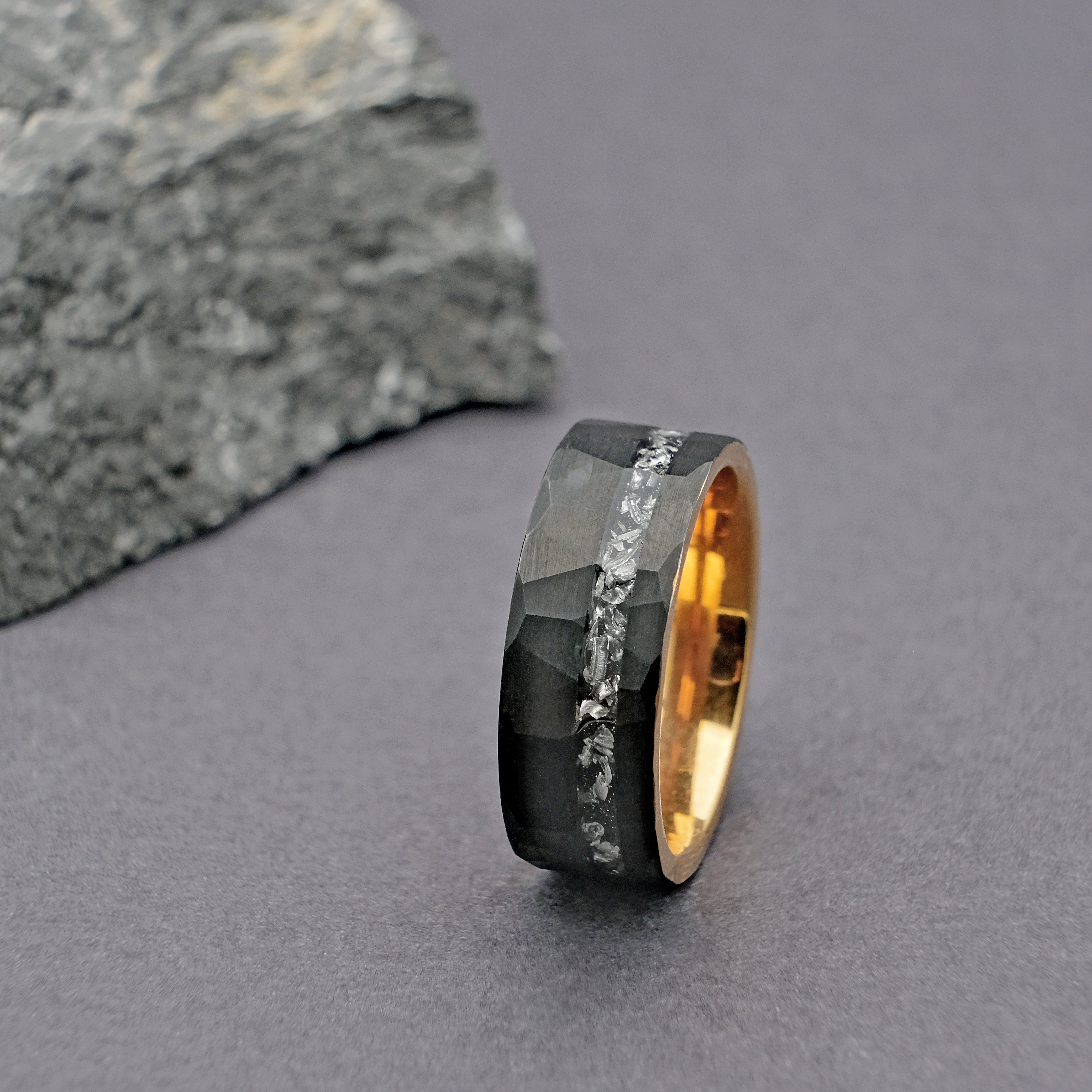 Close-up vertical shot of the Meteorite Black Artisan Tungsten Ring, highlighting the detailed craftsmanship of the meteorite inlay and the polished tungsten carbide.