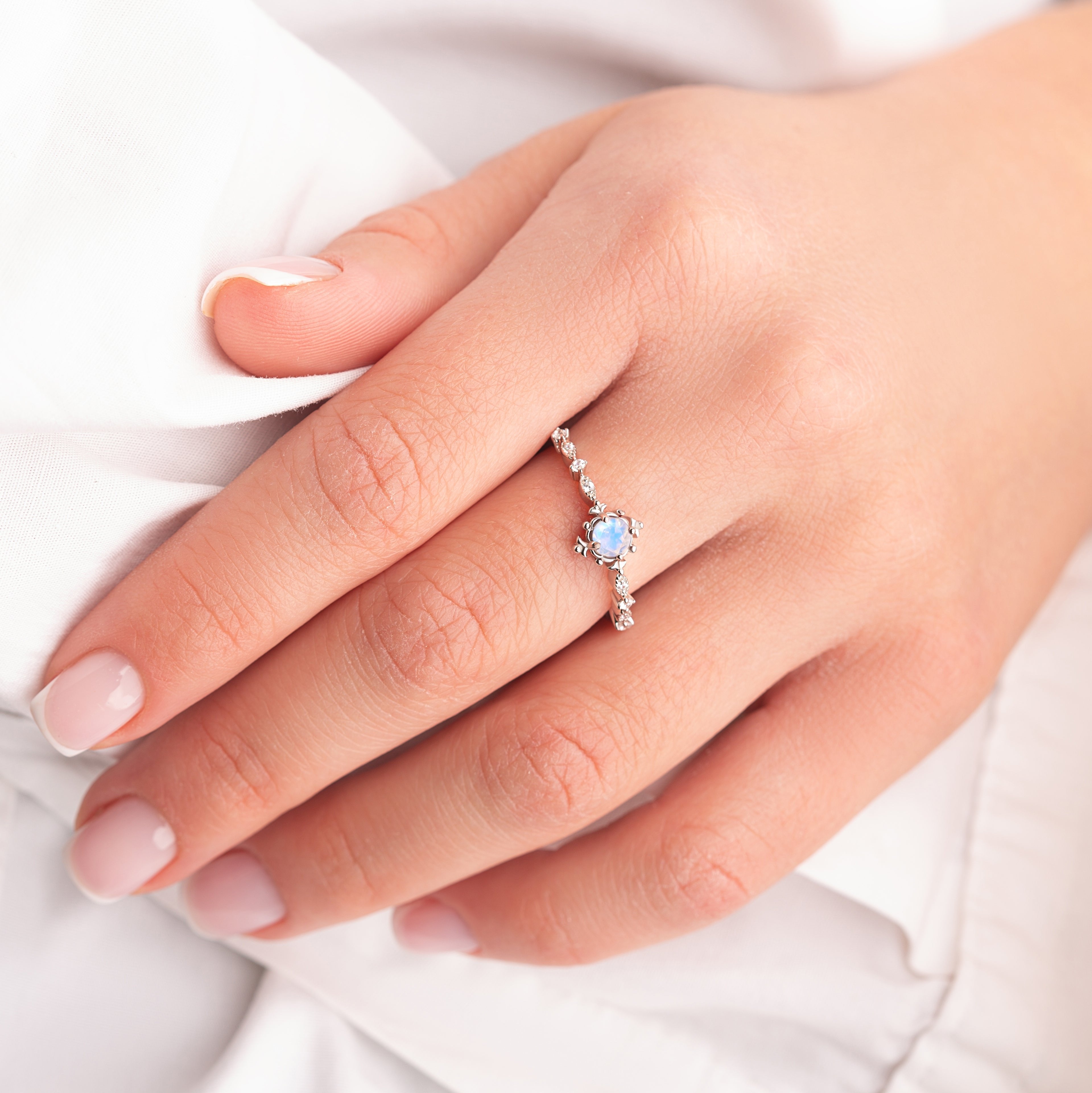 MOON Vintage Sparkling Moonstone Engagement Ring in silver gold worn by a model, showcasing the ring’s radiant Moonstone and elegant design.