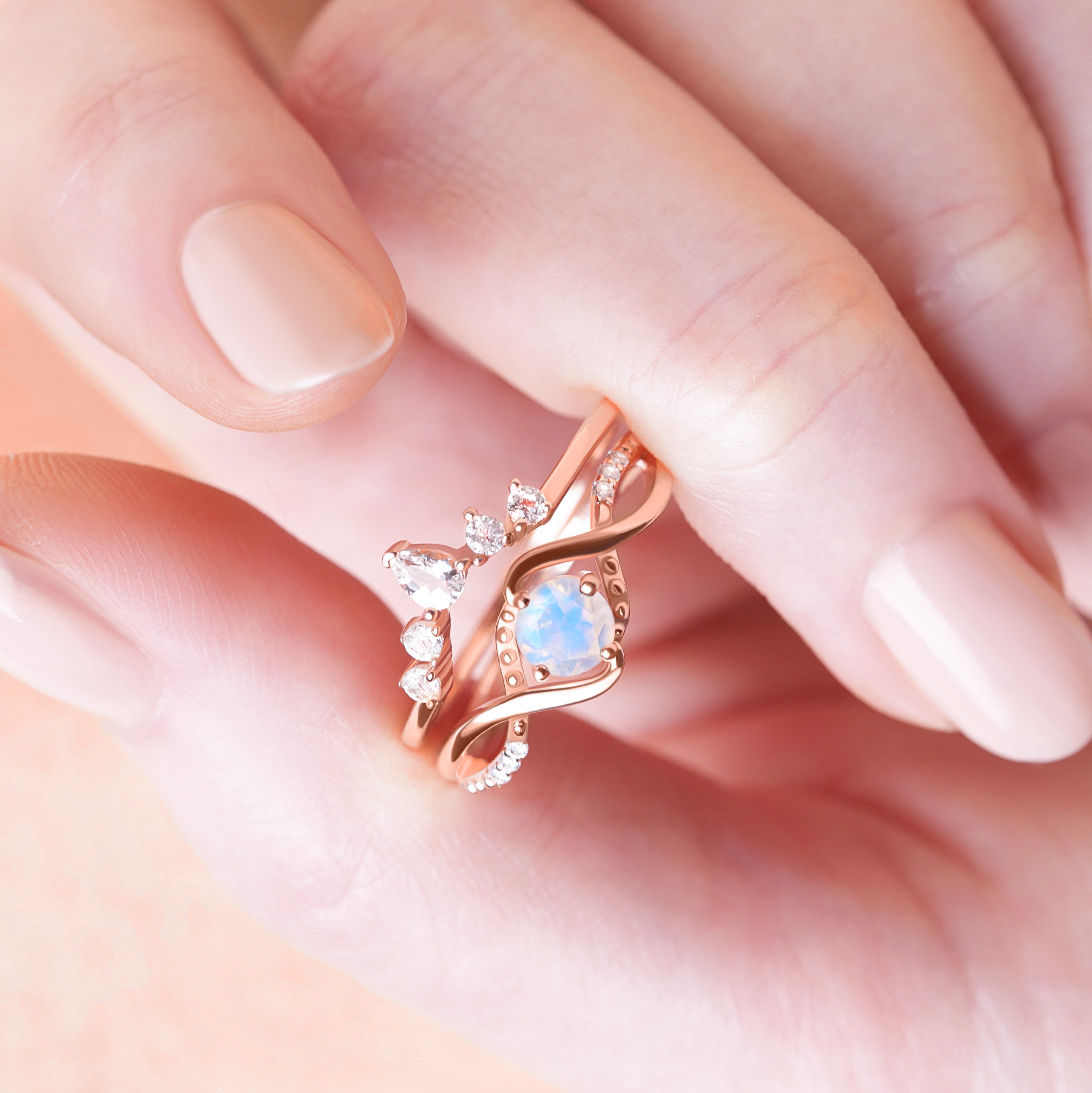 Moonstone Ring Set resting inside the palm of a model, showcasing the harmonious blend of vintage elegance and spiritual symbolism.