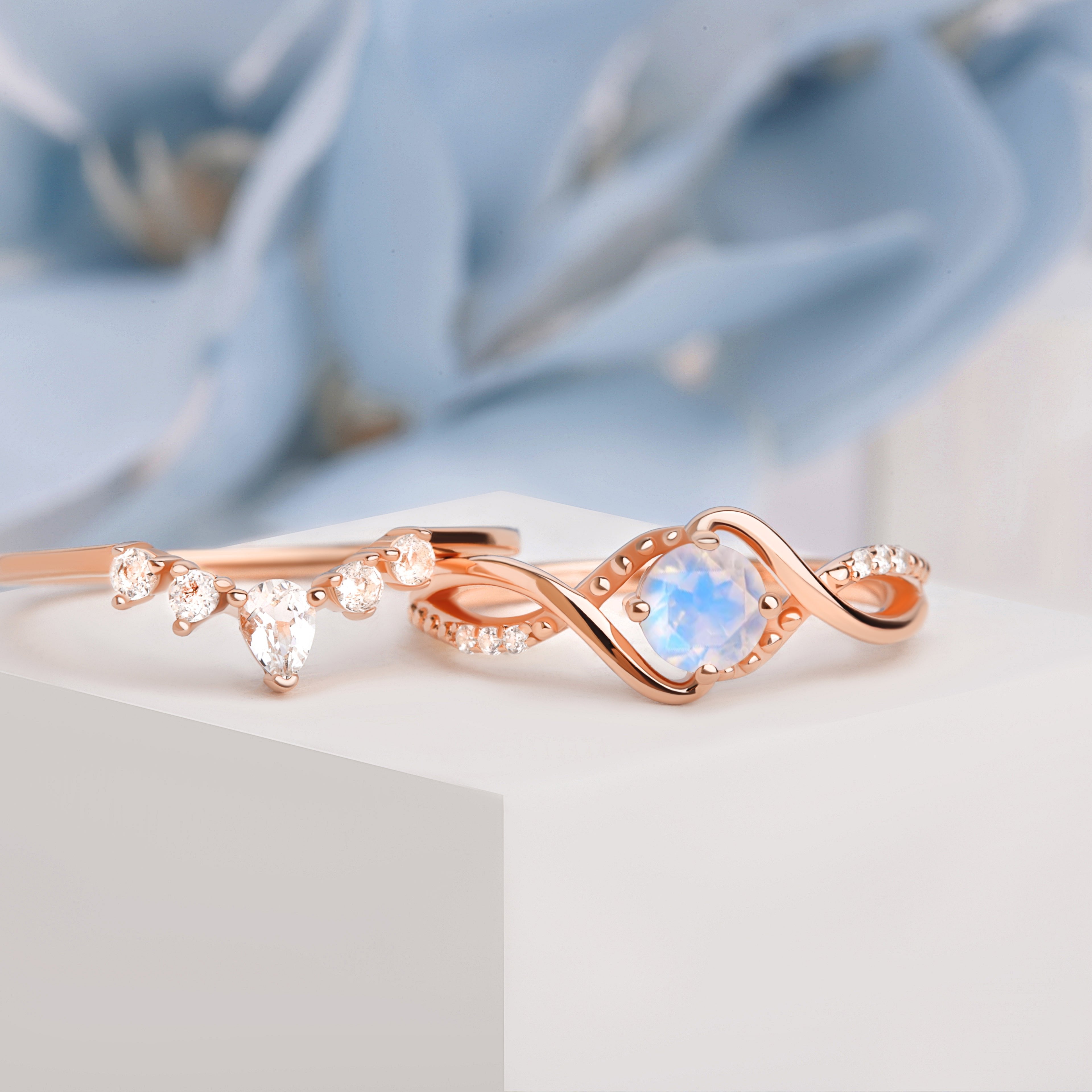 Side front view of the Moonstone Ring Set, capturing the intricate details of the band and the brilliance of the moonstone centerstone.