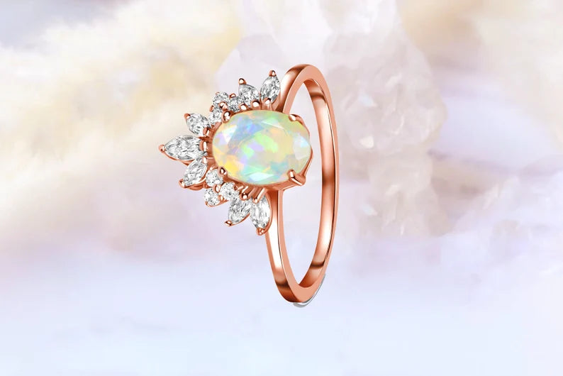 Vertical shot of the Opal Radiance Engagement Ring in rose gold, showcasing the luxurious 24K gold plating and the vibrant Opal Stone.