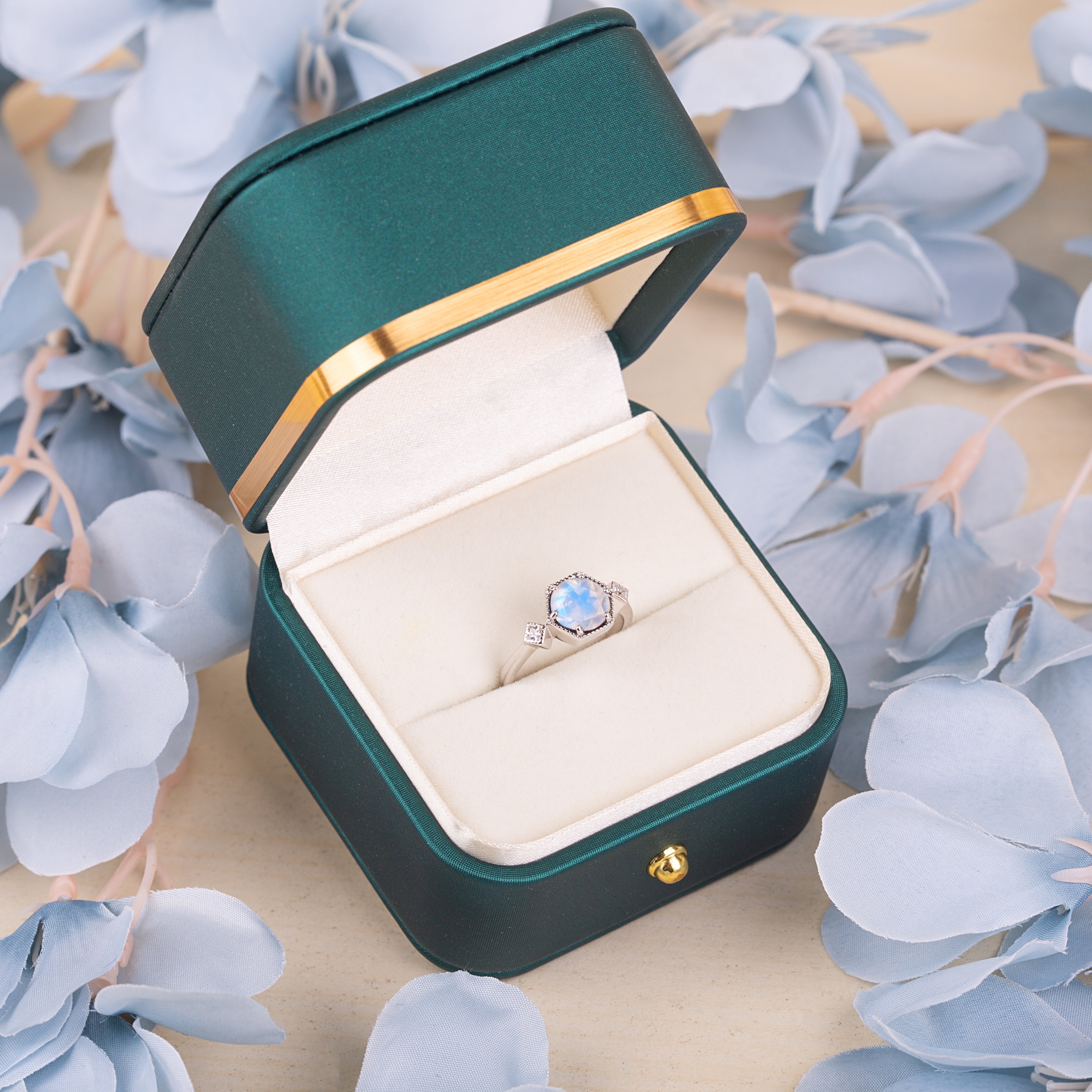 Hexagon moonstone engagement ring displayed in luxury box, emphasizing timeless sterling silver craftsmanship