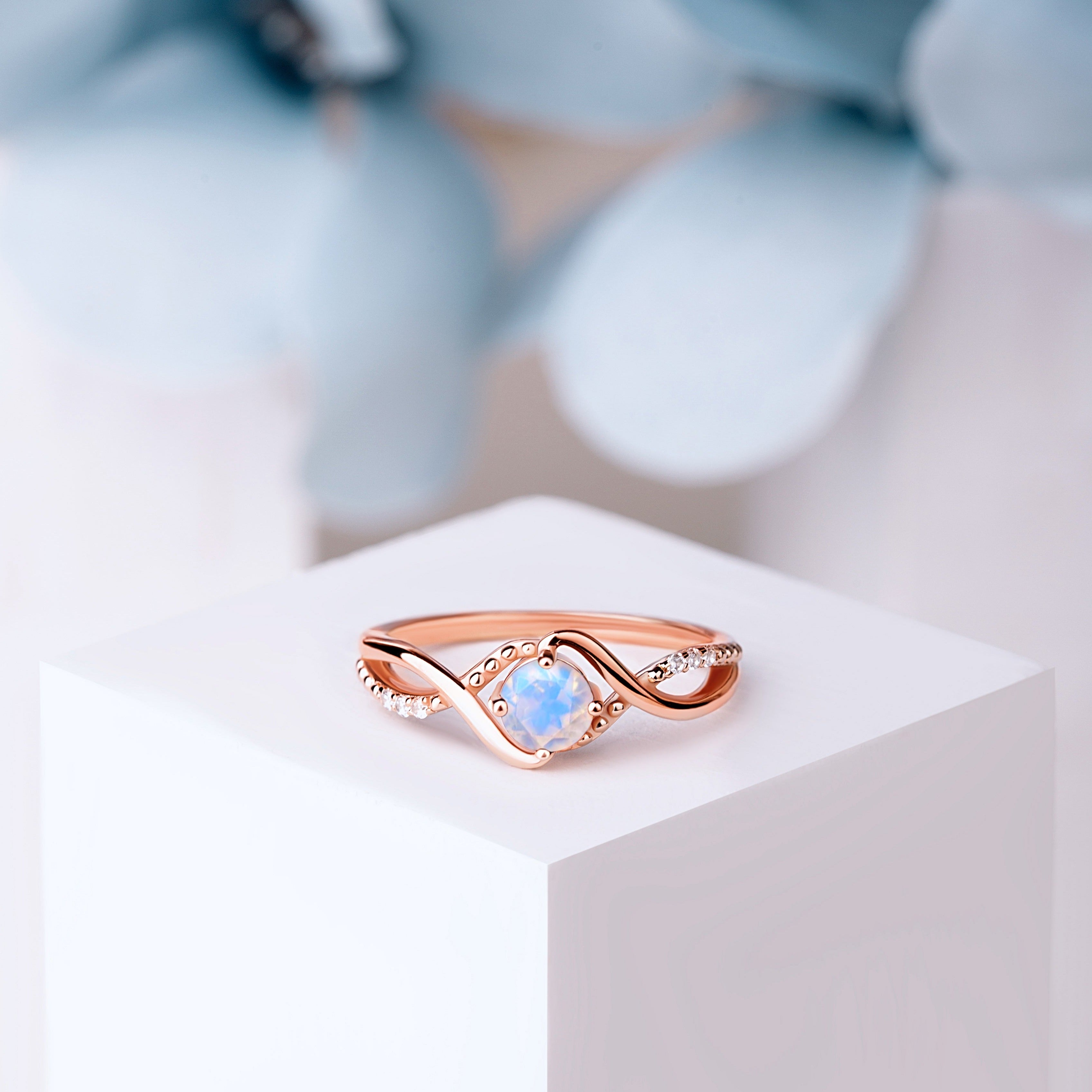 Close-up of vintage Moonstone ring in rose gold, featuring a 6mm oval Moonstone with intricate detailing.