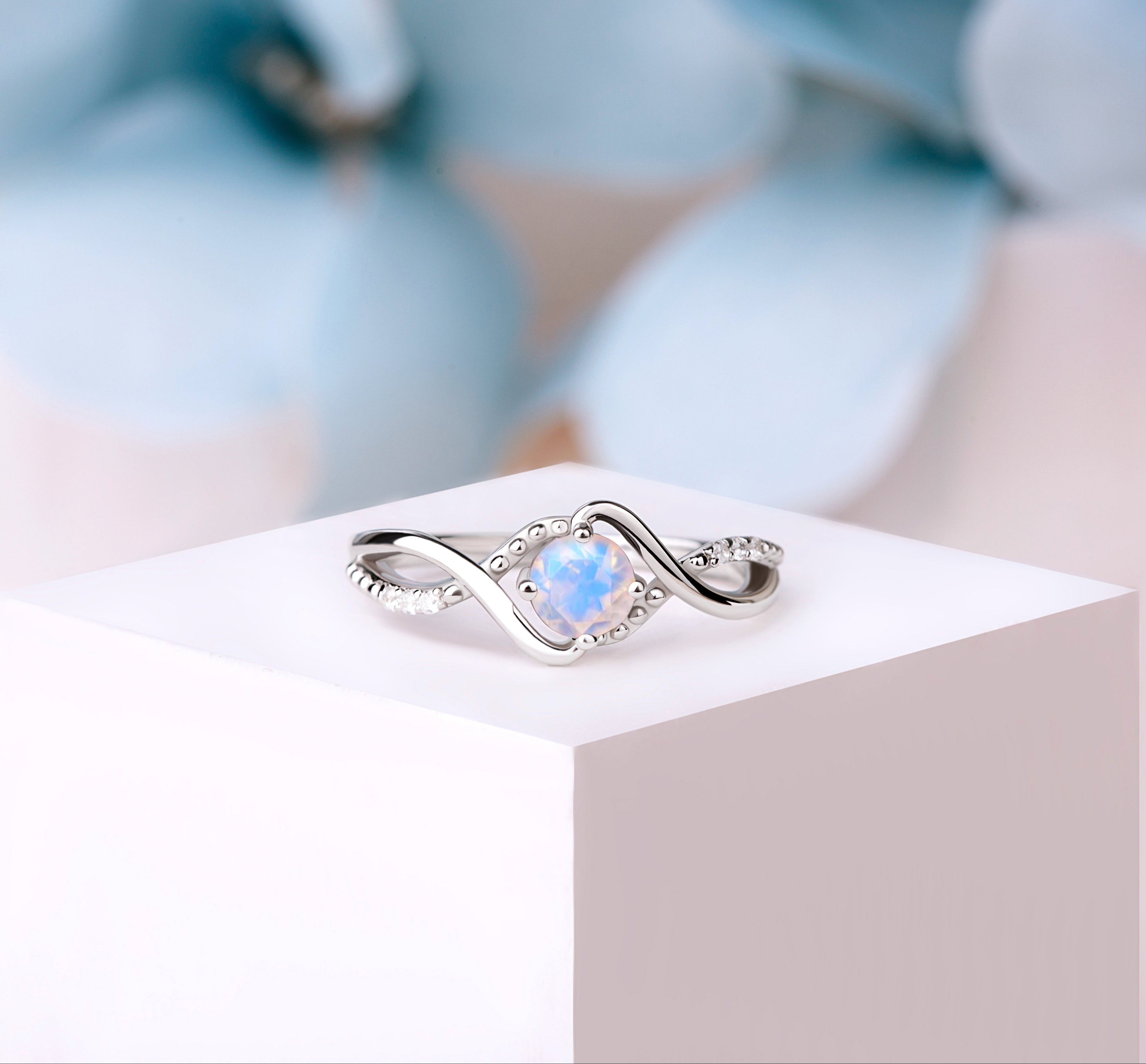 Silver vintage Moonstone ring with a 6mm oval-cut gemstone, showcasing its ethereal glow and detailed craftsmanship.