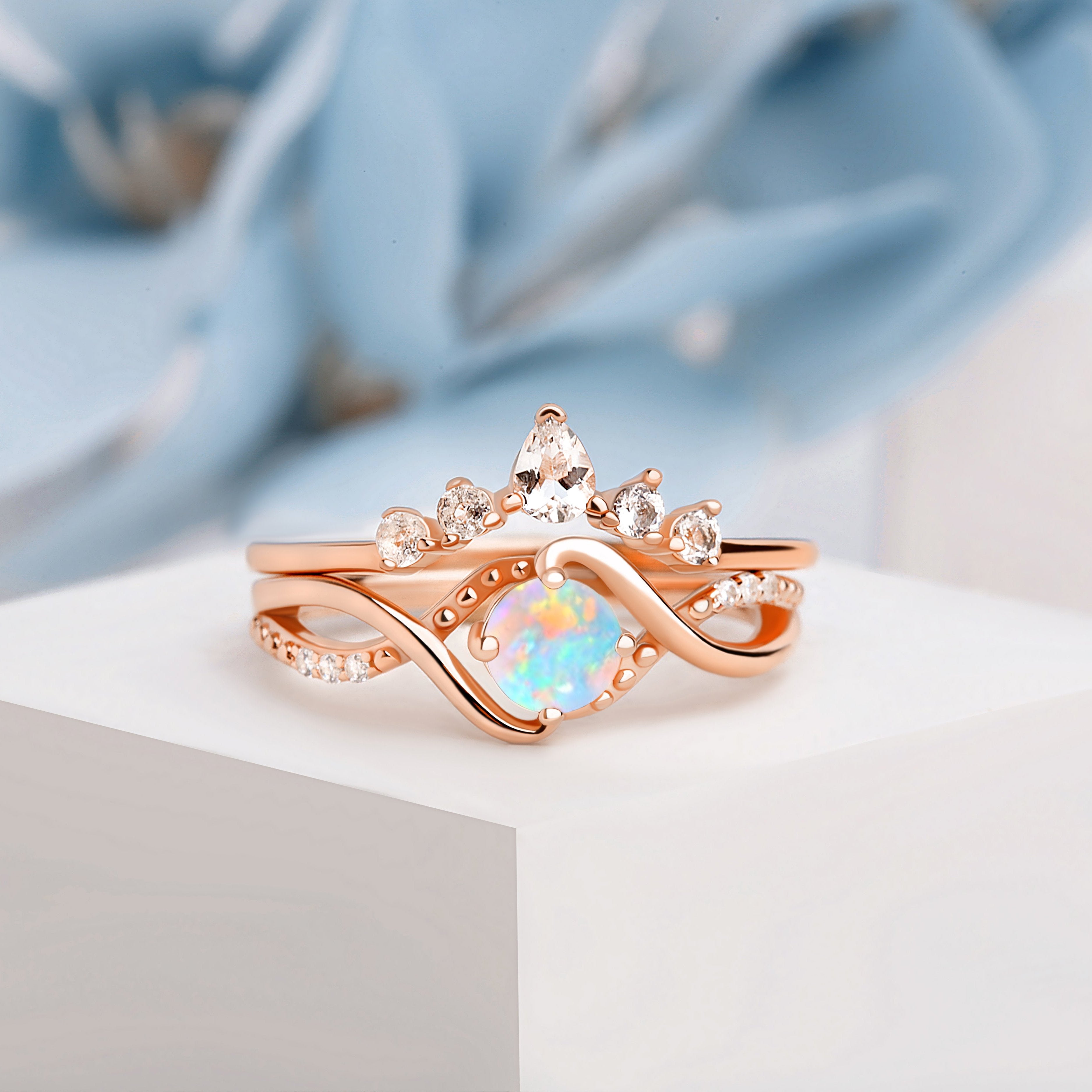 Close-up of the Vintage Opal Engagement Ring, showcasing the mesmerizing opal centerpiece and intricate milgrain detailing in a rose gold band