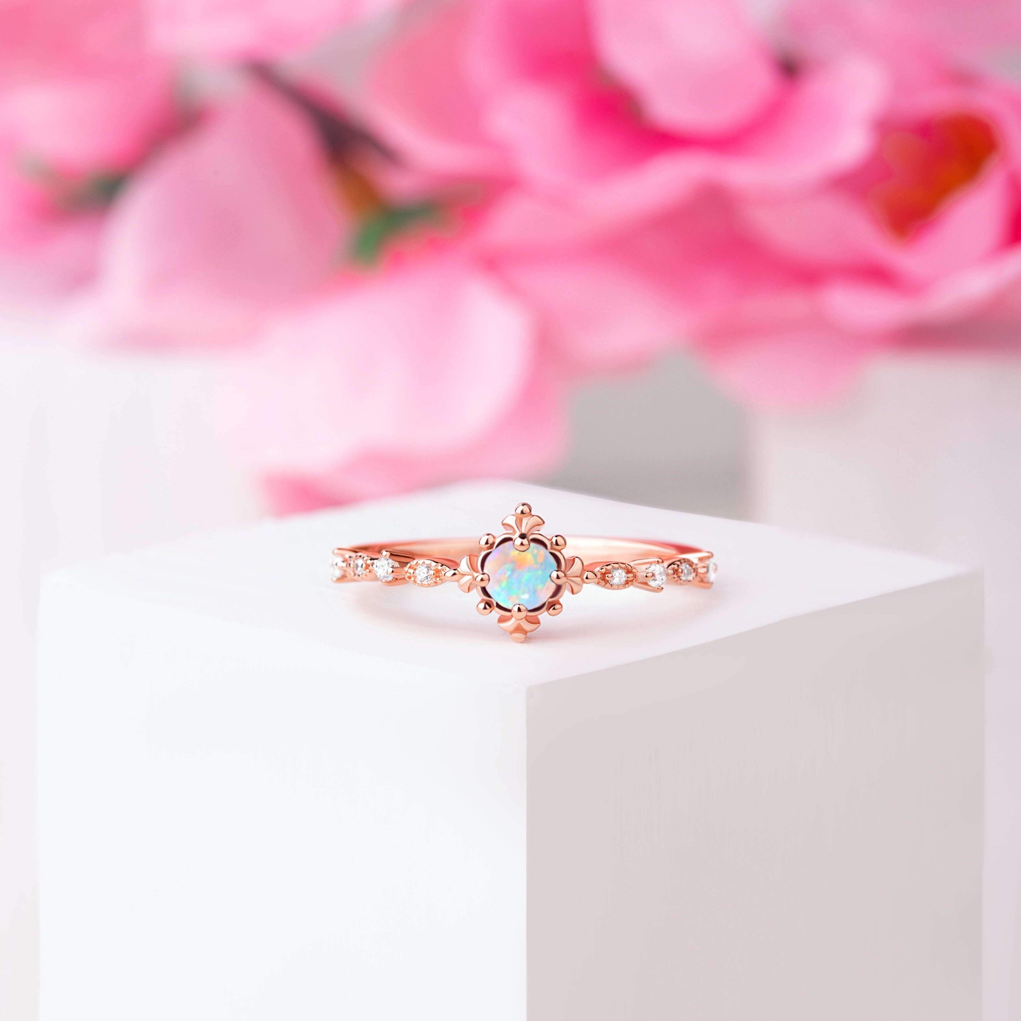 Close-up of vintage opal engagement ring, featuring a 5mm oval-cut Opal gemstone with elegant detailing.