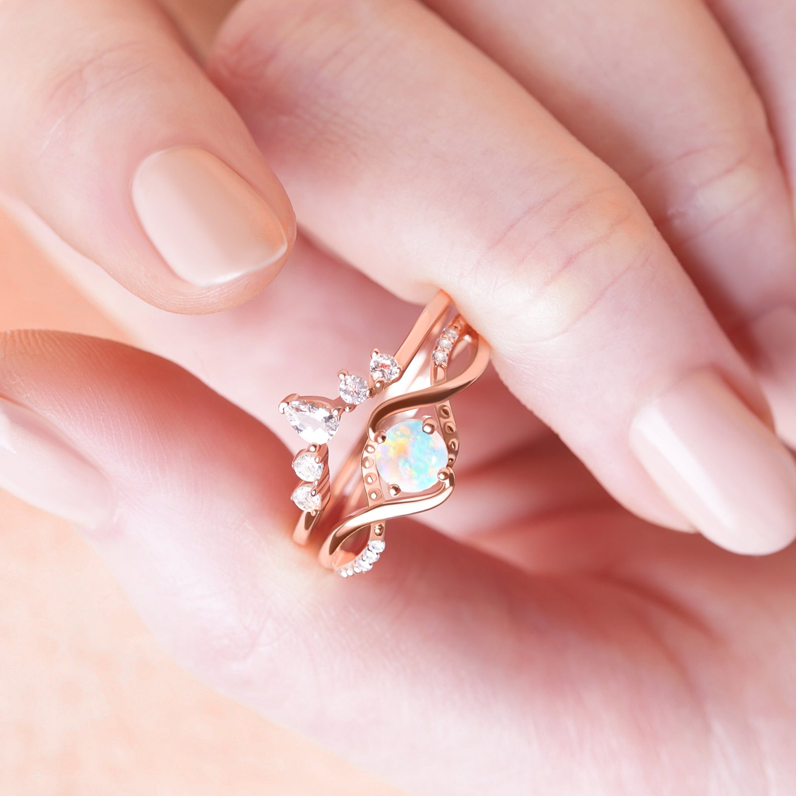 Vintage Opal Engagement Ring displayed inside a model’s palm, emphasizing the ring's captivating opal and vintage charm.